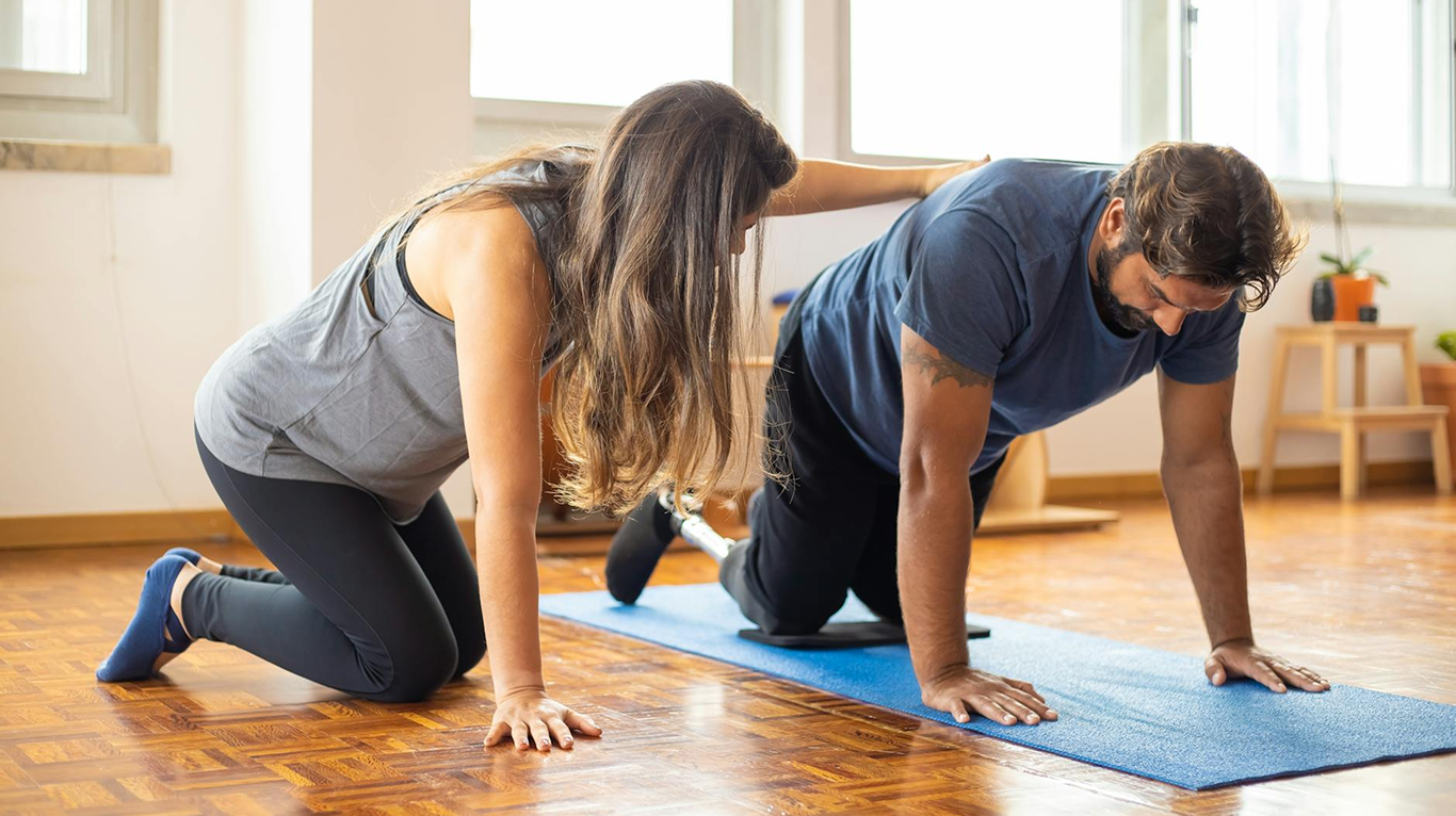 Therapist assisting patient in rehabilitation exercise